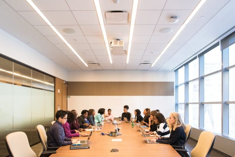 a group of people in a conference room