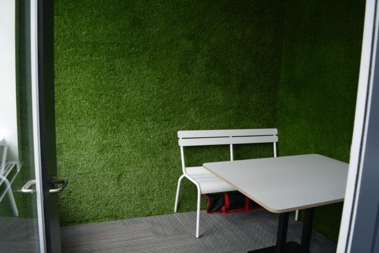 meeting room with grass walls installed by a fit out company