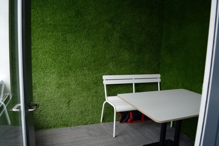 Grass covered walls in meeting room at the Hudl office