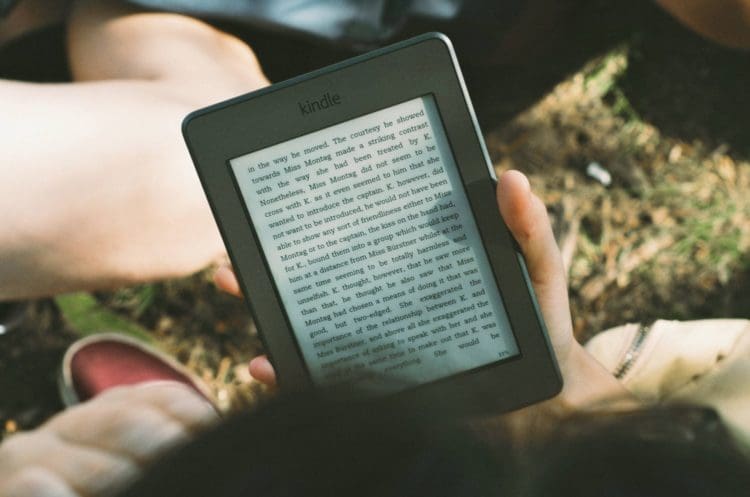 a child using a kindle for a modern school space design