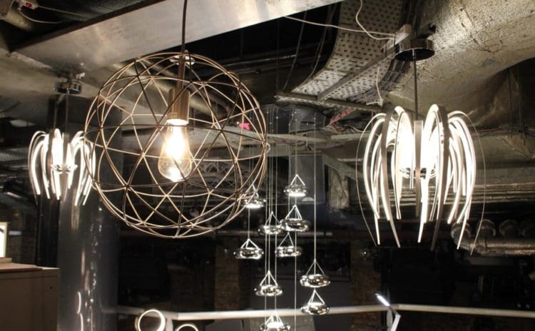 perfect for a london office refurbishment: lights with cascading shells made out of aluminium