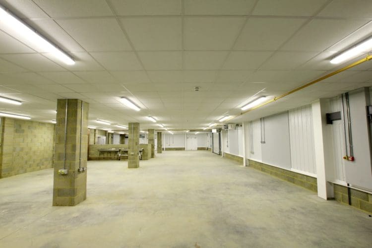a college brickwork workshop with a concrete floor and sinks