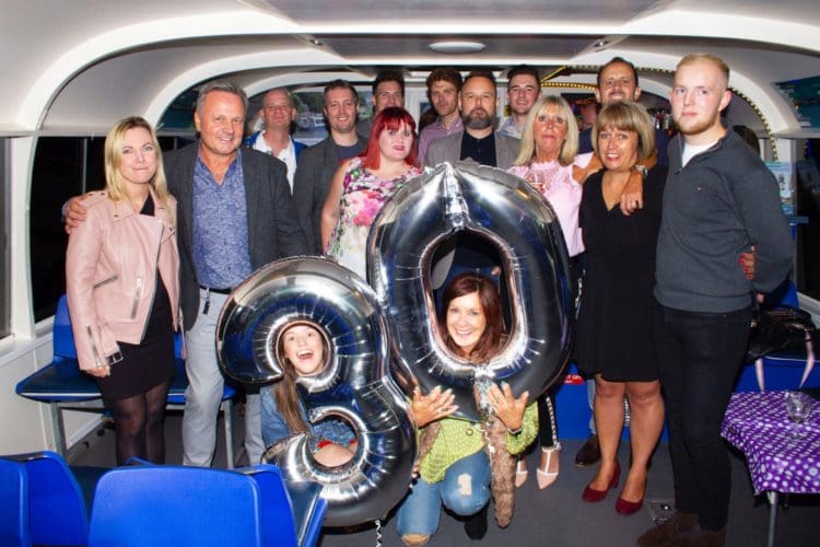 the entire rap interiors team posing for a photograph on board the kentish lady boat