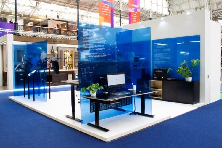 a collection of height adjustable desks on display at one hundred percent design london