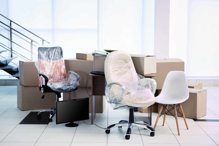 Office furniture being wrapped for an office relocation in London