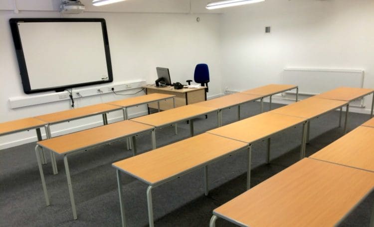 Classroom Interiors with an Electric Whiteboard and Desks