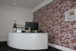Office Reception Area with Brick Affect Wallpaper