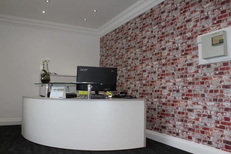 Office Reception Area with Brick Affect Wallpaper