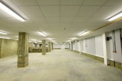 a college brickwork workshop with a concrete floor and sinks