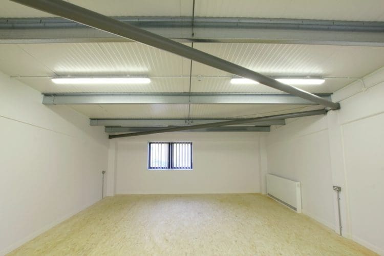 a college construction classroom with an oriented strand board floor