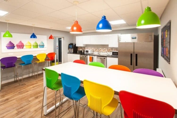 A google inspired office refurbishment with rainbow coloured lights and chairs