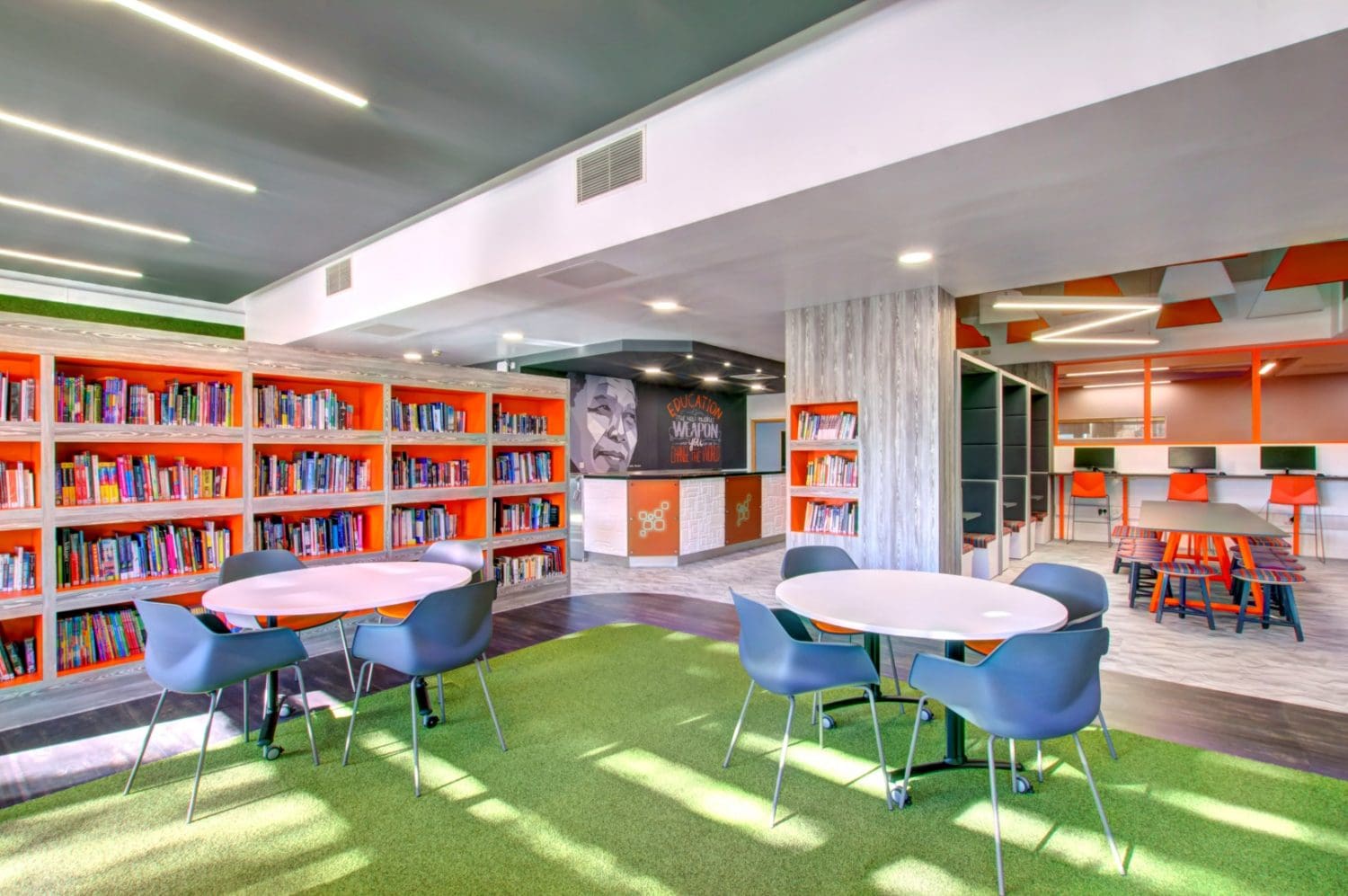 a modern school refurbishment with an artifical grass floor and book shelf