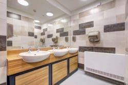 a school washroom design with ceramic tiles fitted by interior fit out company rap interiors