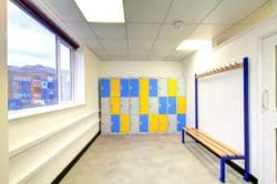 a staff changing room with a wipeable floor and lockers