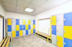 a staff changing room with lockers and benches created by refurbishment company rap interiors