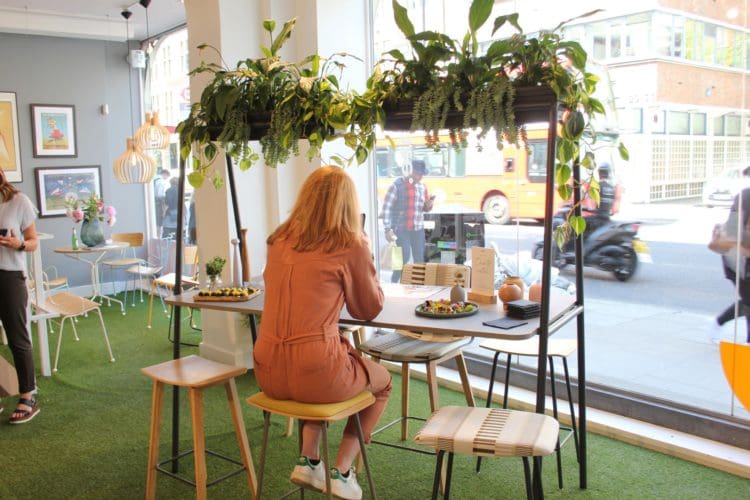 an office workstation with biophilic elements on display at clerkenwell design week