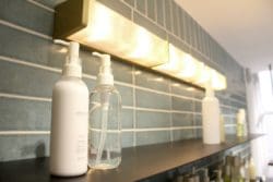 bottled shiro skin care product and flourescent light at the site of their london fit out