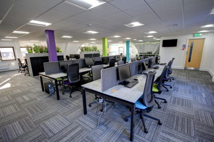 commercial office design with multicoloured pillars and distressed marble desks