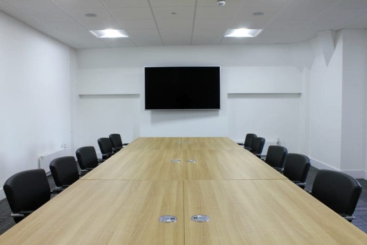 Conference Room Interior Design with a Large Shared Desk and Leather Seats