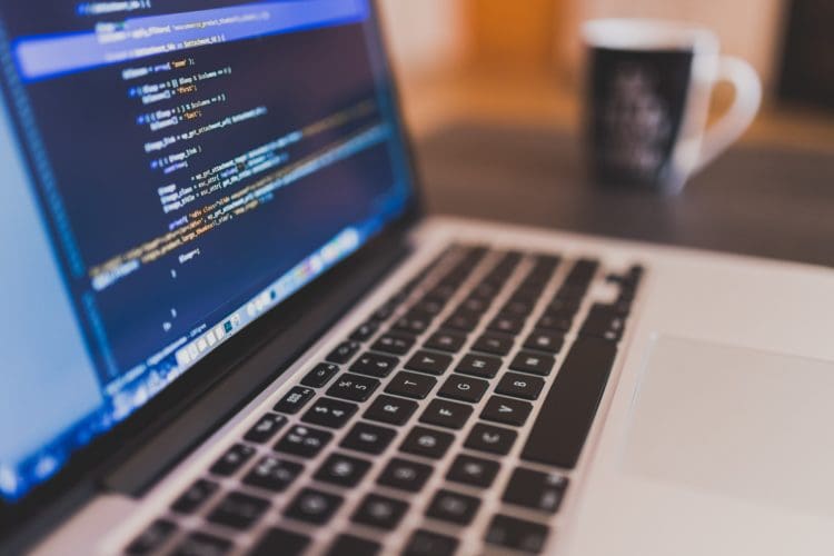 laptop with on screen coding to show fit out company rap interiors are serious about GDPR