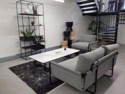 london office interior design with sofas and a modern rug