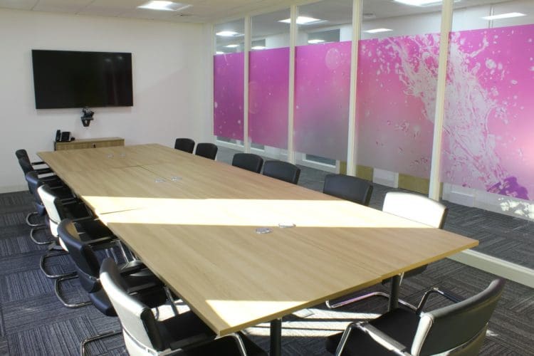 meeting room commercial fit out with a tv and conference desk