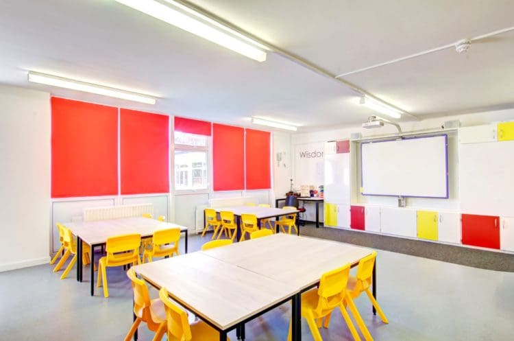 school interior design with yellow chairs and low level tables for children
