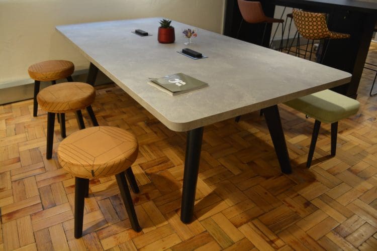 Stone table top and geometric stools displayed at Clerkenwell Design Week