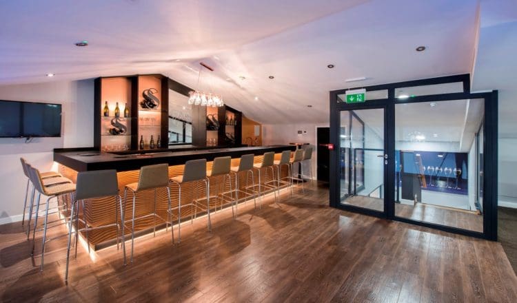 the glasshouse wine tasting room with a bar designed by fit out company rap interiors