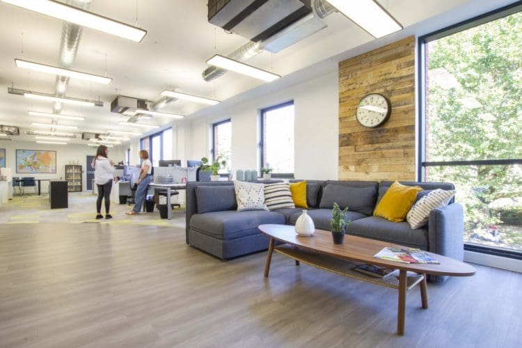 Rustic office design with a reclaimed pallet wood wall