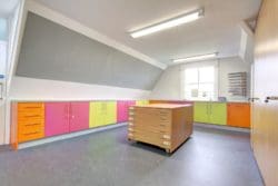 school art classroom design with colourful storage units