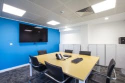 An office meeting room with a meeting room and shared furniture solutions