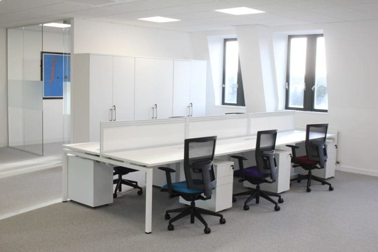 Meeting room with glass partition and white office furniture solutions