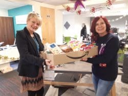 Julie Anderson collecting food for-the-Rap-Interiors help the homeless fundraiser