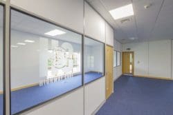 Office interior design with glass partitions and company manifestation