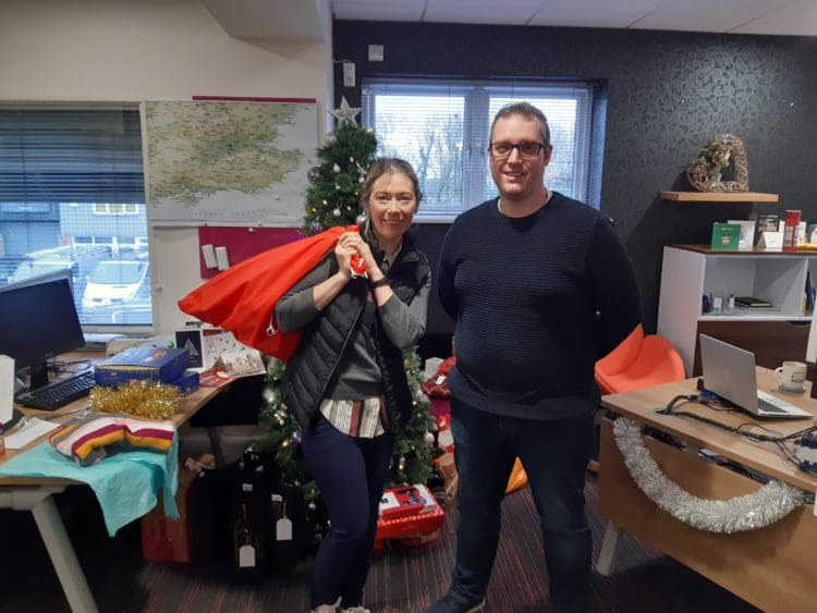 Scott Howard and a contributor to the Rap Interiors homeless Christmas fundraiser