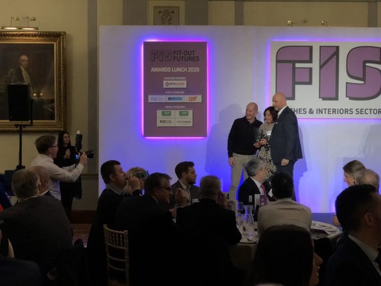 Rap Interiors Design Director Julie Anderson picking up an award at the FIS awards