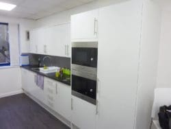 Office breakout area with a white tea point and storage solutions