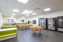 Office canteen with vending machines and heavy duty dining furniture