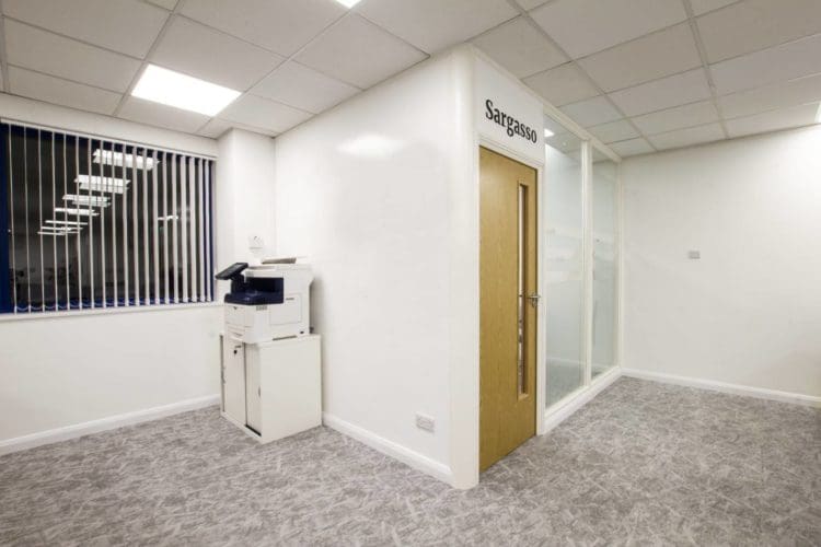 Office meeting room with a creative writing wall and glass partitions with manifestation