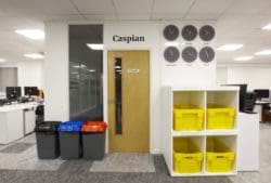 Office meeting room with a tinted glass panel for privacy installed by Rap Interiors