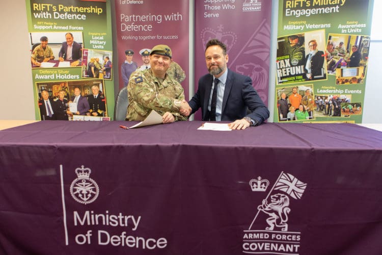 Rap Interiors Commercial Director shaking hands with Major Tony Panayi at a Military Covenant signing