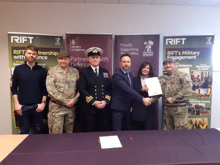 Rap Interiors Directors Martyn Pilcher and Julie Anderson signing a military covenant