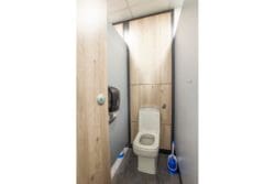 Toilet cubicle with wooden panels