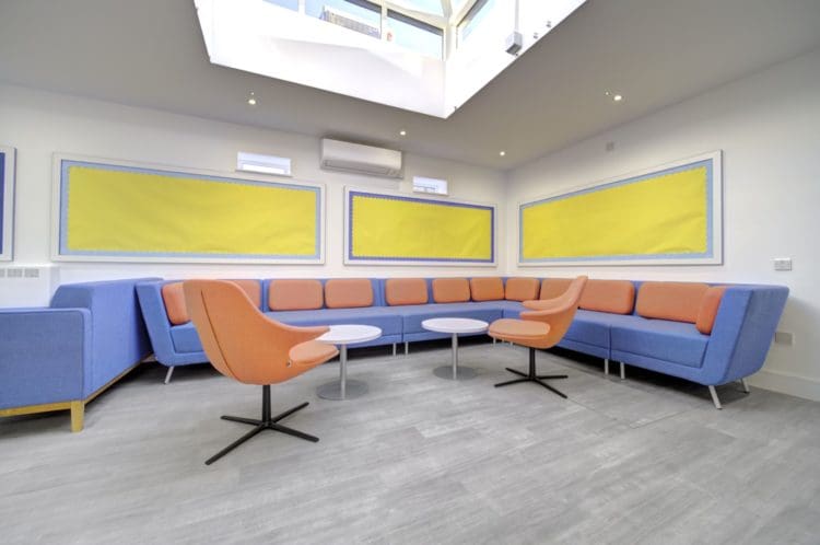 School staffroom furniture including swivel chairs and a modular corner sofa