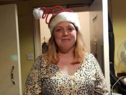 School Teaching Assistant in Christmas Hat for Care Homes Campaign