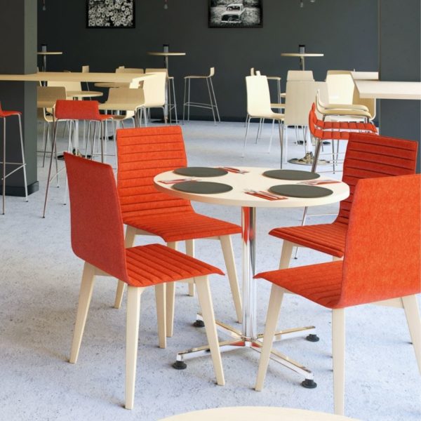 Bright red Bjorn café style chairs in a ribbed upholstery with wooden leg frames in an office canteen environment