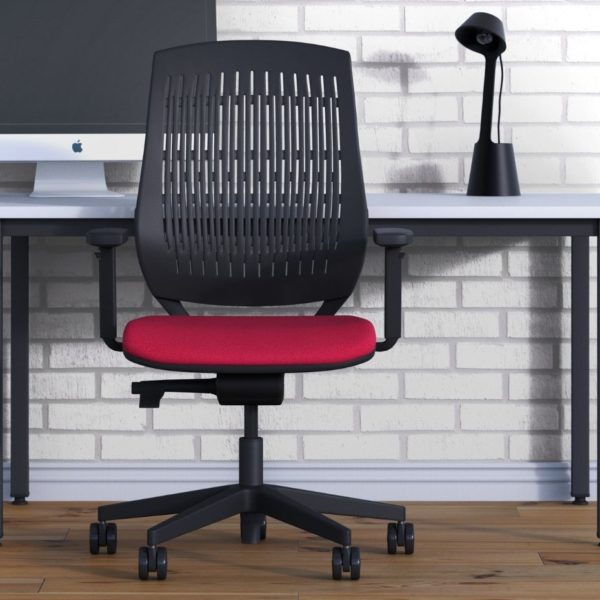Bond office task chair with a flexible curvature high back and an upholstered seat pad in red next to a desk set up