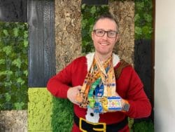 Interior designer Scott proudly showing his 5k running medals to support his mental health during the pandemic