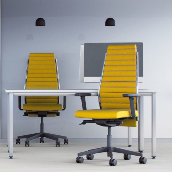 Two high quality mustard yellow ribbed upholstered task chairs for working at an office desk.